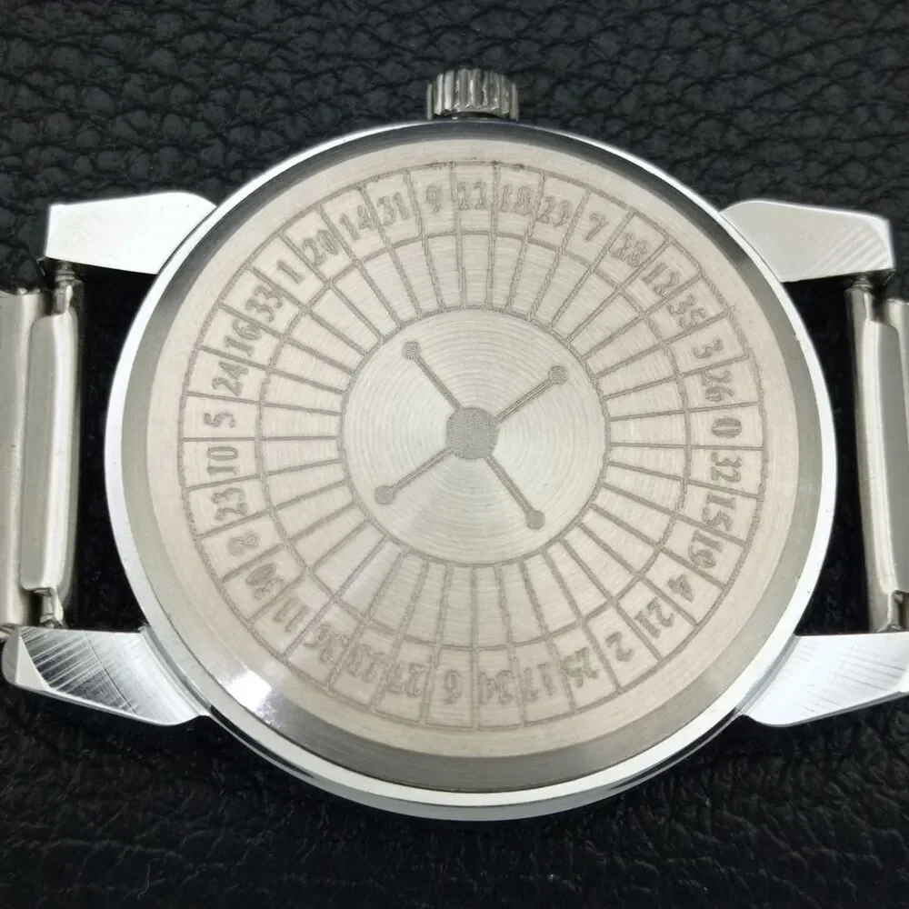 Vintage 1971 Roulette Manual Mens Silver Watch W/Steel Strap & Yellow accents